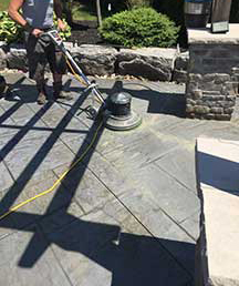 Using a scrubbing machine to speed decorative concrete sealer